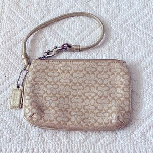 2/$35 Coach gold/Platinum wristlet